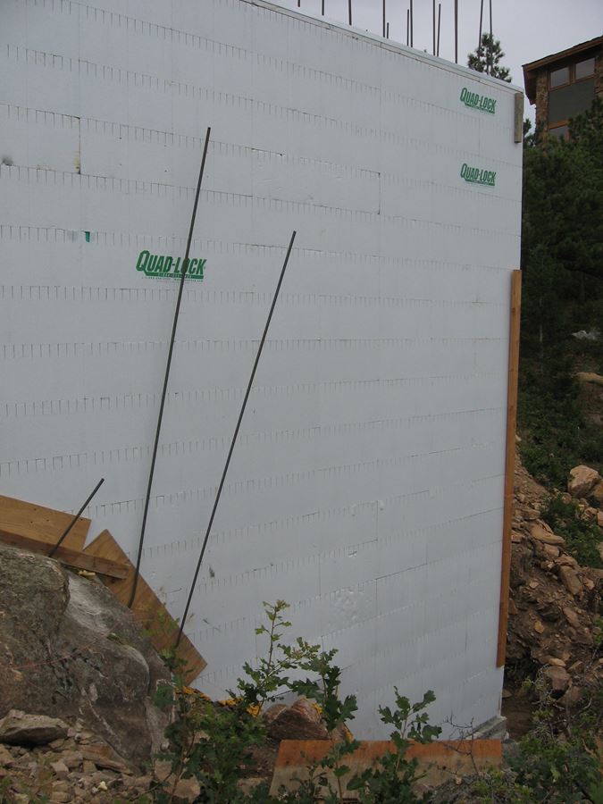 Quad-Lock ICF Home Built on the Rocks - corner built around rocks - Energywise Sustainable Products CO